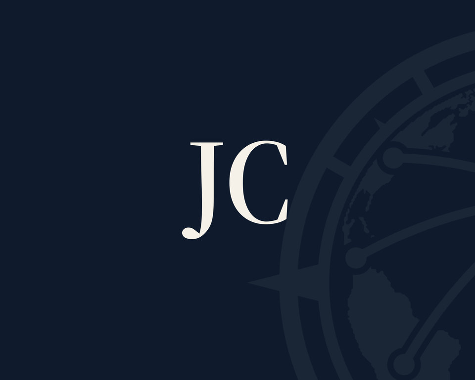 The firm’s navy backdrop with the initials JC